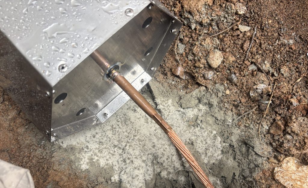 Crimped connection between the carbon grounding electrode and bare copper conductor